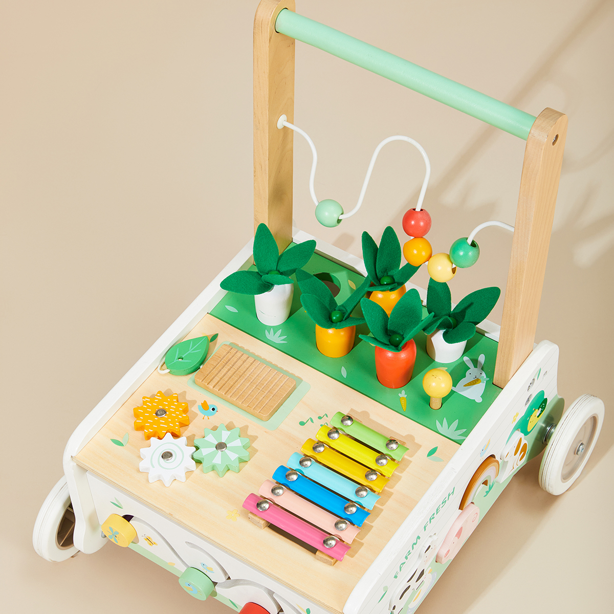 Close-up of farm baby walker with bead maze, xylophone and rotating gears