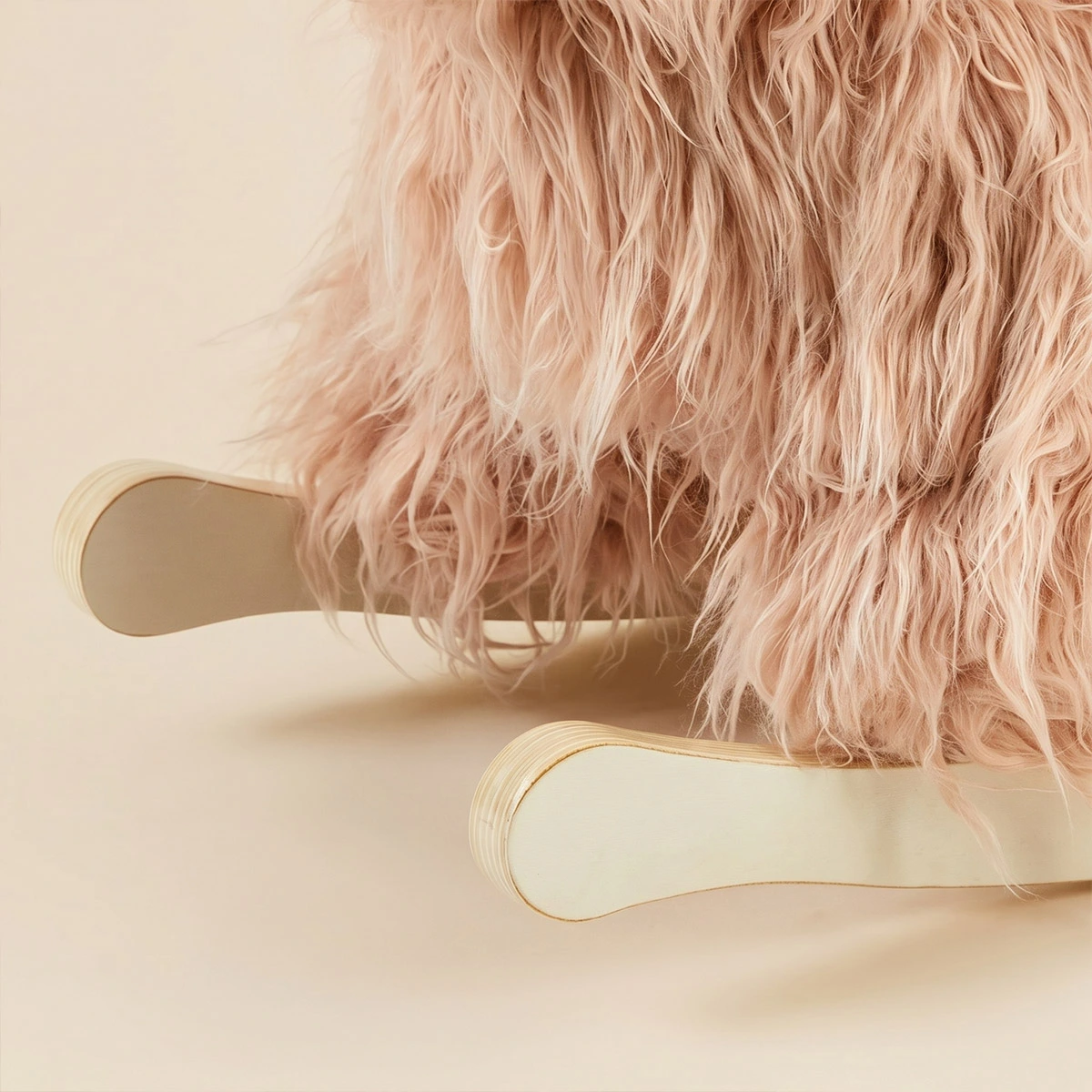 Close-up of labebe wooden rocker base and soft plush yak fur