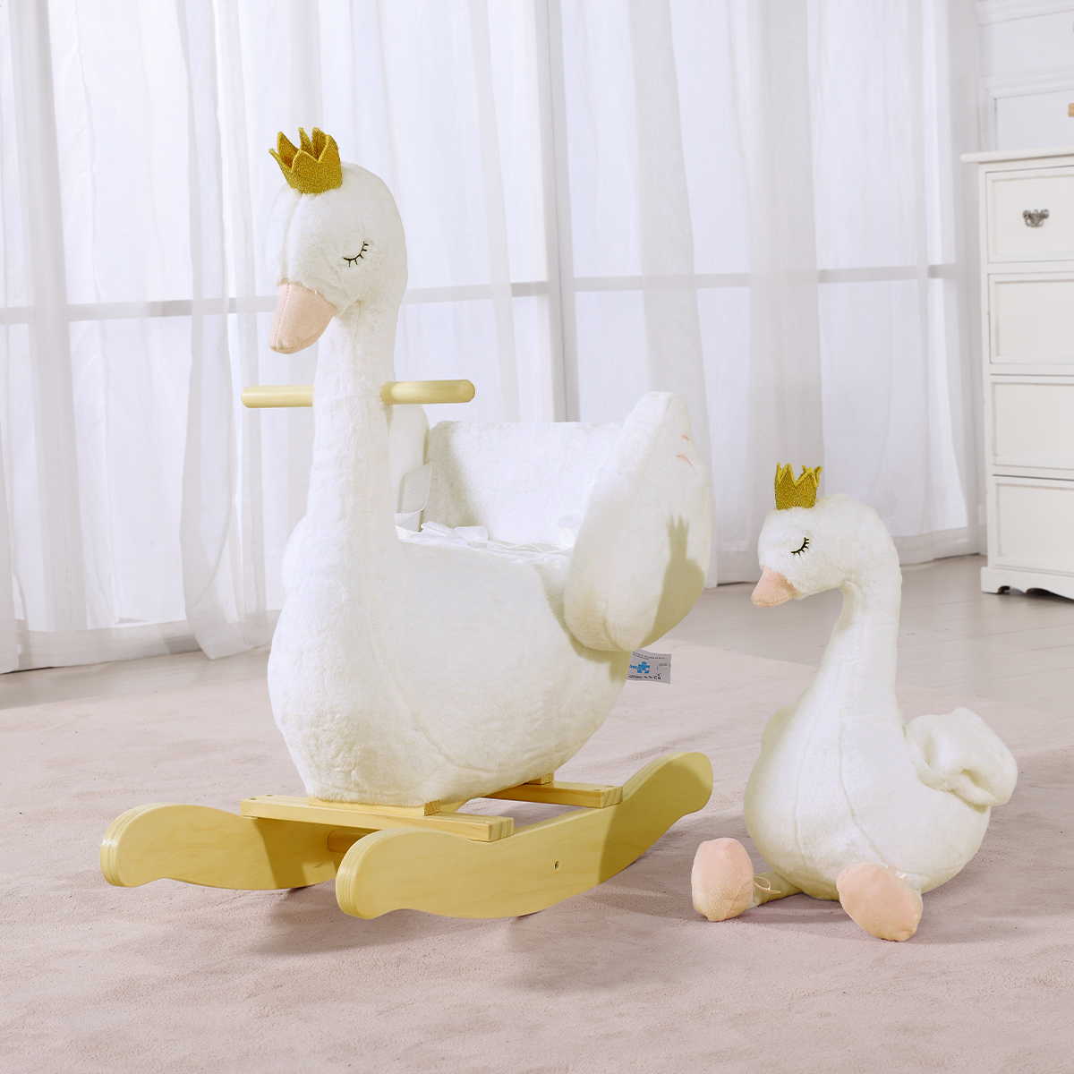 White swan plush rocker and matching swan toy for nursery playroom