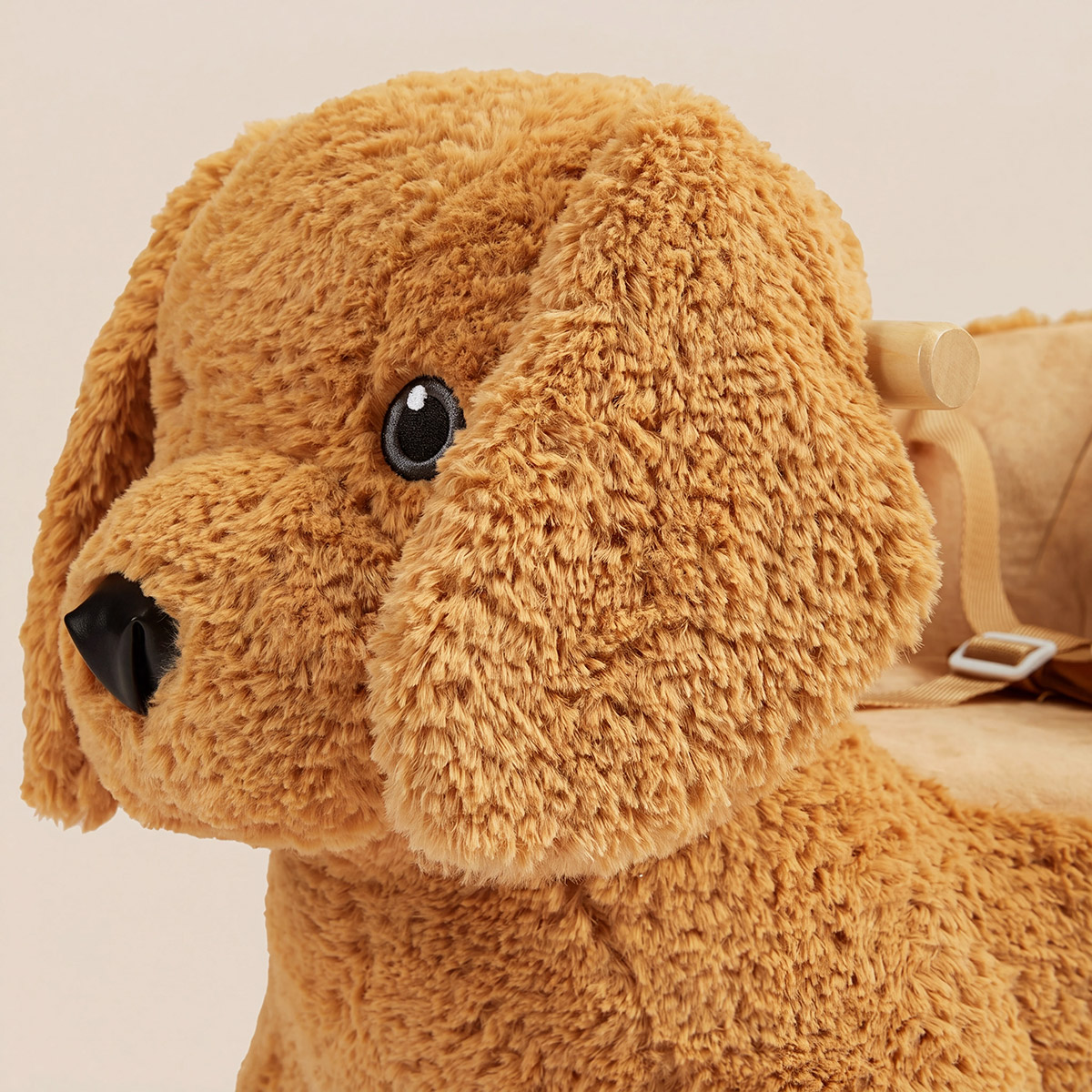 Close-up of plush Labrador puppy rocker with soft brown fur and friendly face