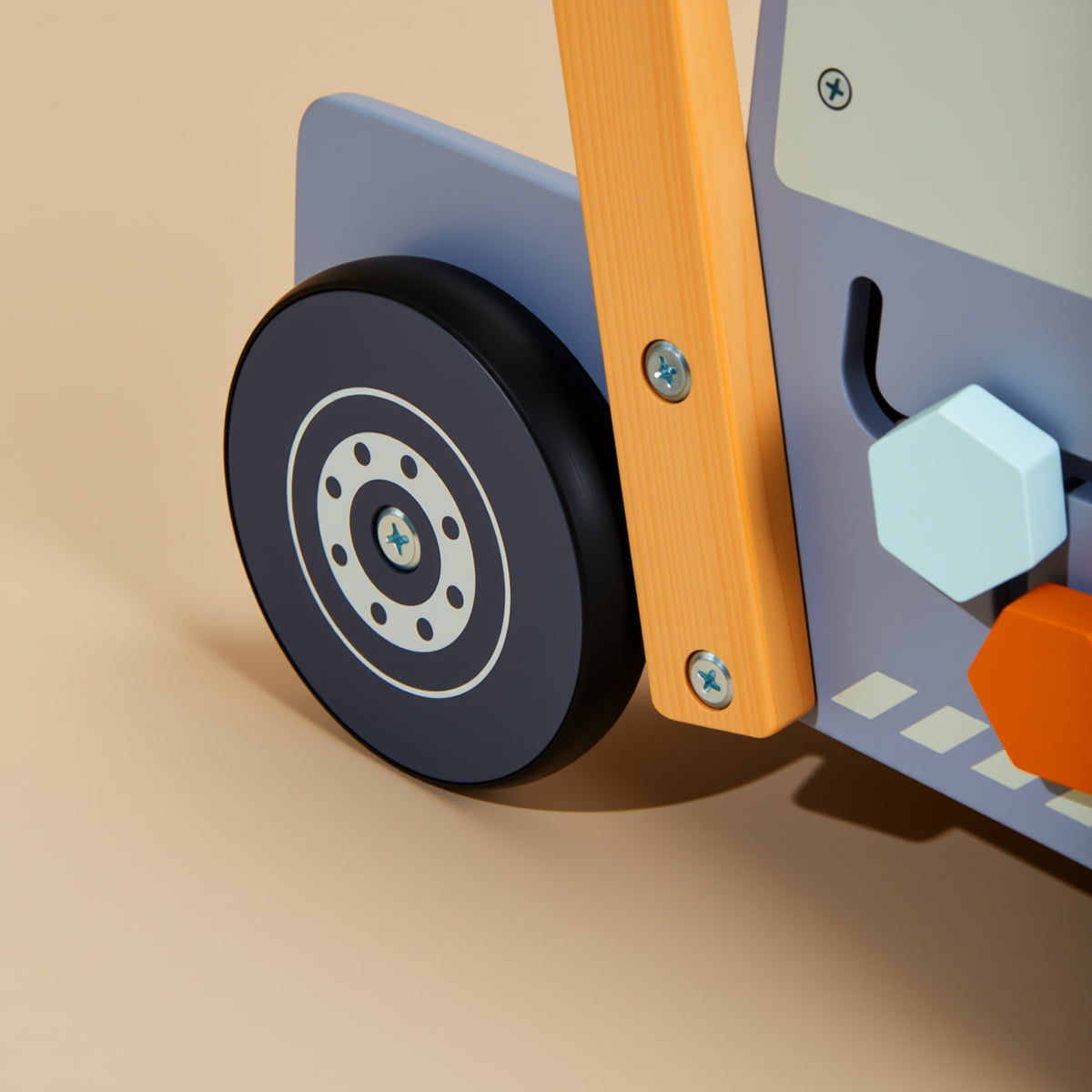 Close-up of rubber wheel and sturdy wooden frame on toddler walker