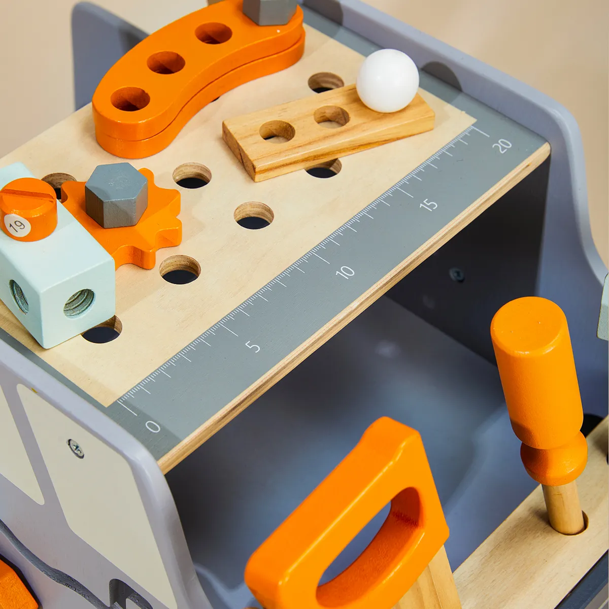 Close-up view of wooden tool bench worktable with screws gears and hammer