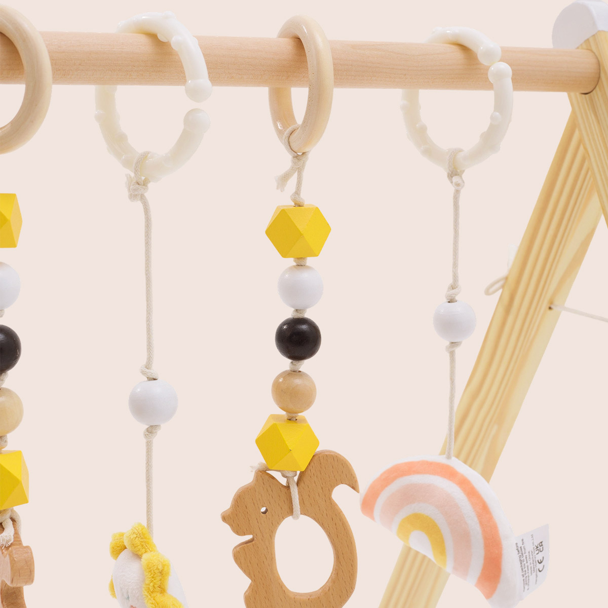 Close-up of wooden infant play gym sensory toy rings